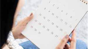 Woman looking at calendar.